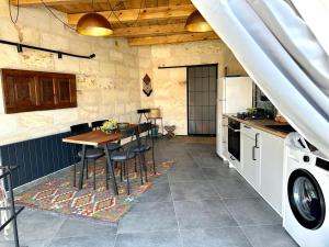 a kitchen with a table and a dining room at Casa Chilai Cappadocia in Ürgüp