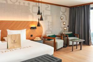 Ein Bett oder Betten in einem Zimmer der Unterkunft Le Tahiti by Pearl Resorts