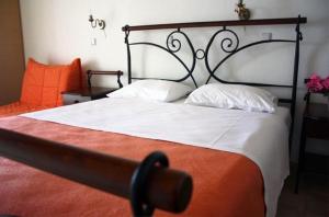 Postel nebo postele na pokoji v ubytování Hotel Rigakis