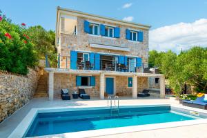 a villa with a swimming pool and a house at Villa Marceline in Prvić Luka