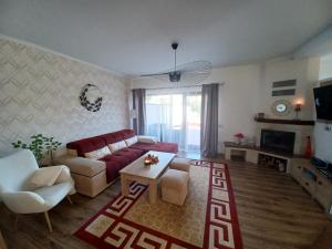 a living room with a couch and a table at Vila Gloria ,Brașov in Ghimbav