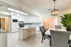 a kitchen and dining room with a table and chairs at Stunning Baton Rouge Home with Pool Near LSU! in Baton Rouge