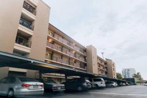 a parking lot with cars parked in front of a building at *Msg for 5%off*2Bed2Bath KingBeds MidtownPHX Condo in Phoenix