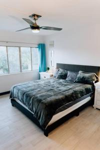 a bedroom with a large bed with a ceiling fan at *Msg for 5%off*2Bed2Bath KingBeds MidtownPHX Condo in Phoenix