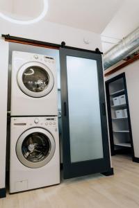 a washer and dryer in a room with a door at *Msg for 5%off*2Bed2Bath KingBeds MidtownPHX Condo in Phoenix