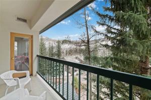a balcony with a view of a snowy mountain at Borders Lodge by East West Hospitality in Beaver Creek