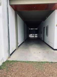 an empty hallway of a building with a garage at Sarmiento - 1A in Concordia