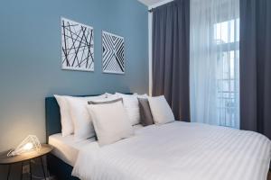 Posteľ alebo postele v izbe v ubytovaní Seven Wishes Boutique Residence by Dwellfort