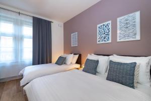Posteľ alebo postele v izbe v ubytovaní Seven Wishes Boutique Residence by Dwellfort