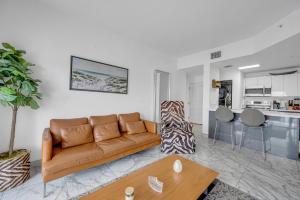 a living room with a couch and a table at Subtle 2 Bed in Edgewater near Downtown With Free Parking in Miami