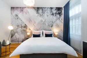Posteľ alebo postele v izbe v ubytovaní Seven Wishes Boutique Residence by Dwellfort