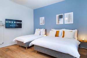 Posteľ alebo postele v izbe v ubytovaní Seven Wishes Boutique Residence by Dwellfort