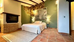 En eller flere senge i et værelse på Casa Rural La Cordonera