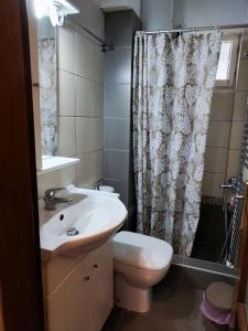 a bathroom with a sink and a toilet and a shower at 4ALL Airport 10min,Sea100m,Free parking in Thessaloniki