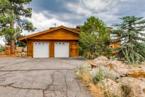 a house with two garage doors on a driveway at The Modern Moose Lodge in Truckee