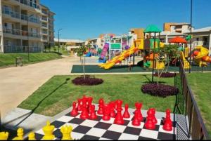 a chess board in front of a playground at Ilhas do Lago Resort in Caldas Novas