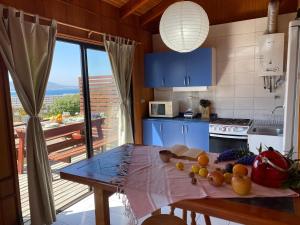 a kitchen with a table with fruit on it at CABAÑAS DE LA LUNA in Los Molles