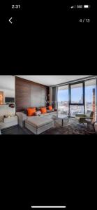 a living room with a couch and a table at Amazing view 18th floor at Palms place Las Vegas in Las Vegas