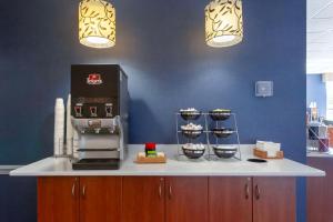 a counter with a coffee maker on top of it at Best Western Summit Inn in Niagara Falls