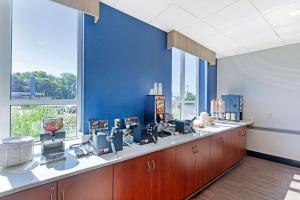 a waiting area in a dental office with a blue wall at Best Western Summit Inn in Niagara Falls