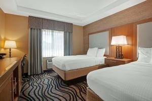 a hotel room with two beds and a window at Best Western Summit Inn in Niagara Falls