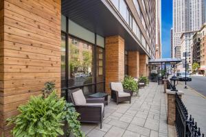 a patio outside of a building with chairs at Sonesta ES Suites Chicago Downtown Magnificent Mile Medical in Chicago