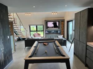 a living room with a pool table in it at Luxury hot tub & sauna apartment with pool table in the centre of northern ireland,sleeps 6 people in Coalisland