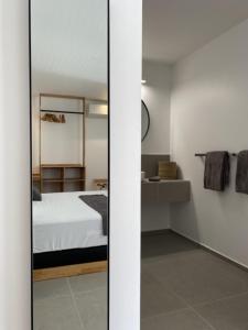 Krevet ili kreveti u jedinici u okviru objekta Hôtel Lune de Miel
