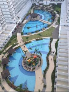 an overhead view of a large swimming pool at a resort at Shell Residences near Mall Of Asia in Manila