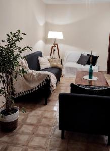 a living room with a couch and a table at LA CASA DE LA NONA in Guaymallen