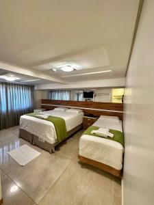 Postel nebo postele na pokoji v ubytování Hotel Imperatriz