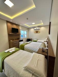 Postel nebo postele na pokoji v ubytování Hotel Imperatriz