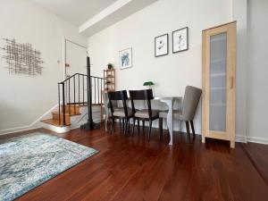 a dining room with a table and chairs at The Orange House in Washington, D.C.
