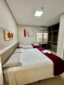Postel nebo postele na pokoji v ubytování Hotel Imperatriz