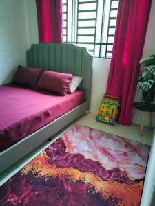 a bedroom with a bed and a window with pink curtains at Creatills luxury homestay Kulim & hi-tech in Kulim