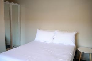 Postel nebo postele na pokoji v ubytování Beltana Hotel