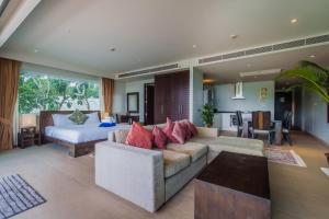 a living room with a couch and a bed at Daisy 2 Bed Amazing Seaview in Rawai Beach +62 photos
