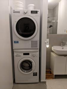 a washing machine and a washer in a bathroom at Luxury, Spacious, Sunny home in the heart of Berlin in Berlin