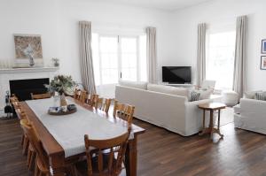 a living room with a table and a couch at Yallingup Homestead Guest House in Dunsborough