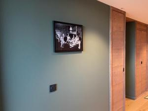 a picture hanging on a wall in a room at Méribel Mottaret - Appartement 3 chambres, 6 pers, parking, terrasse, skis aux pieds - FR-1-613-105 in Les Allues