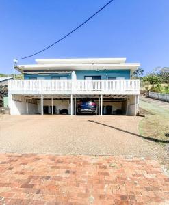 a car parked in the garage of a house at Beach Bungalow Yeppoon in Yeppoon