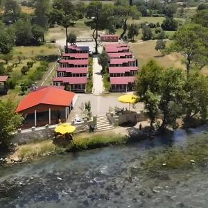 an aerial view of a resort next to a river at Kanyon Yaşam Evleri in Manavgat