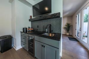 a kitchen with a sink and a counter top at Luxury Getaway at The Village in Columbus