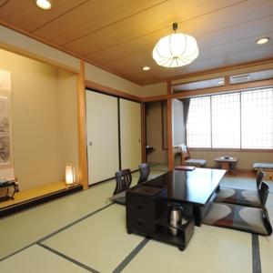 an office with a conference room with a table and chairs at Ryokan Ichinomatsu in Hakodate
