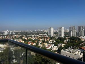 a view of a city from the top of a building at New apt Stunning view steps from hospital! in Ramat Gan
