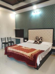 Lova arba lovos apgyvendinimo įstaigoje Saanidhya home stay