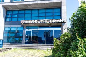 a building with a sign that reads hotel the grande at Hotel The Grang Jungmun in Seogwipo