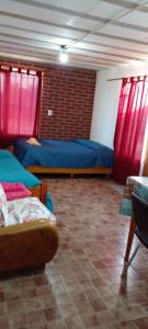 Ліжко або ліжка в номері Calendulas del Cabo