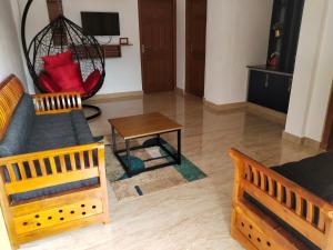 TV/trung tâm giải trí tại Casa Maria Mystica apartments, Mananthavady, Wayanad