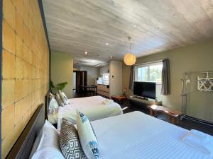 Ένα ή περισσότερα κρεβάτια σε δωμάτιο στο Niseko VILLA KIRAKU TSURU 車利用にオススメ 各スキー場迄車で約15分 +33 φωτογραφίες
